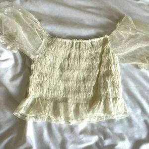 White puffy sleeve short sleeve top with white lace.
